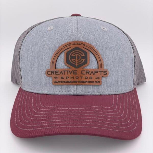 Gray and Crimson Richardson 112 Hat with Creative Crafts and Photos Logo Engraved on Brown Leatherette Patch.