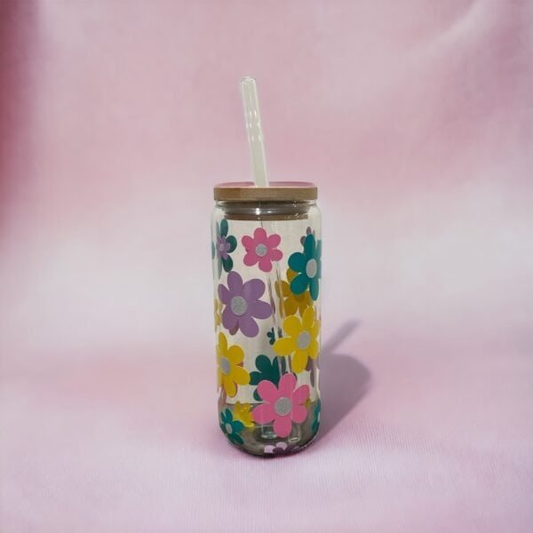 Glass cup with bamboo lid showing multi size and multi color basic flowers.