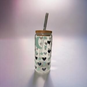 Glass cup with bamboo lid showing a crescent moon and alternating stars and hearts.